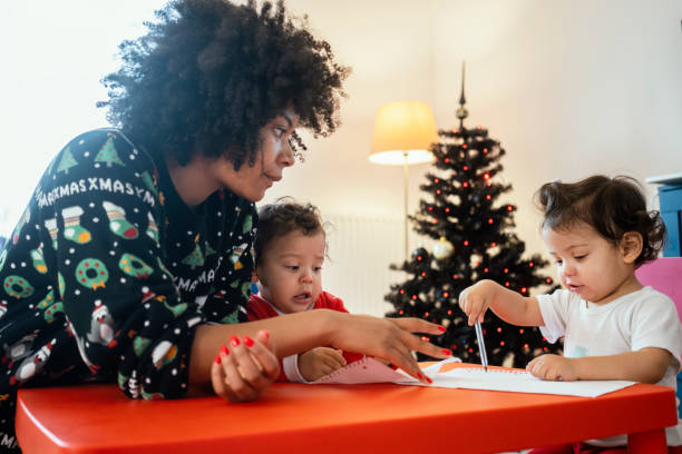 istock Mom and babies at home for Christmas 1248156285