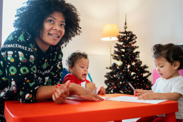 istock Mom and babies at home for Christmas 1248156321
