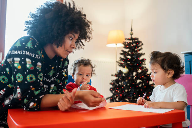istock Mom and babies at home for Christmas 1248156388