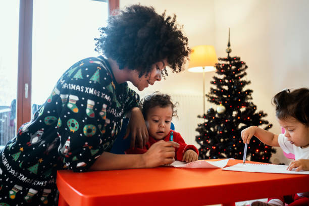 istock Mom and babies at home for Christmas 1248156456