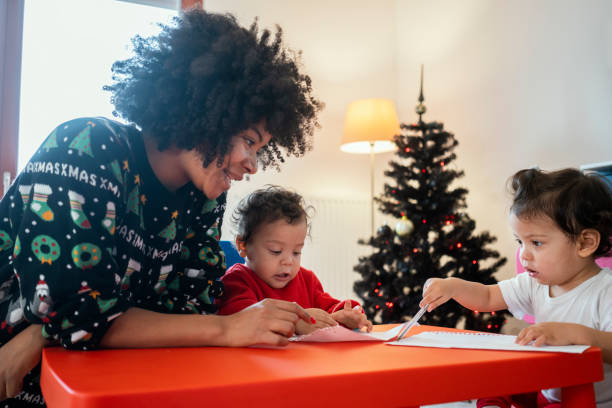 istock Mom and babies at home for Christmas 1248156612