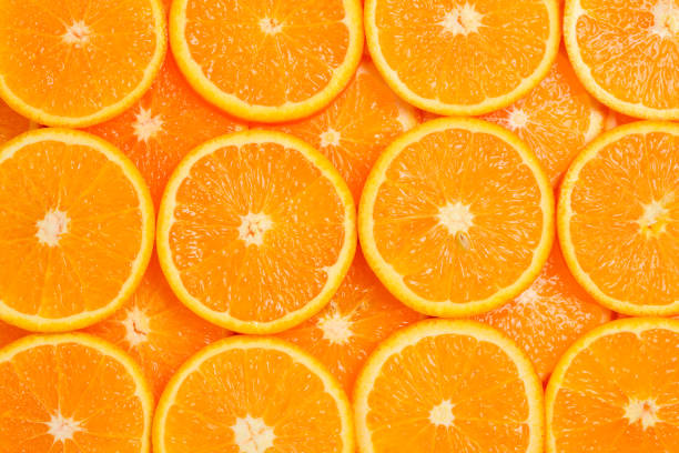 istock Slices of oranges as a background, top view. 1248156944