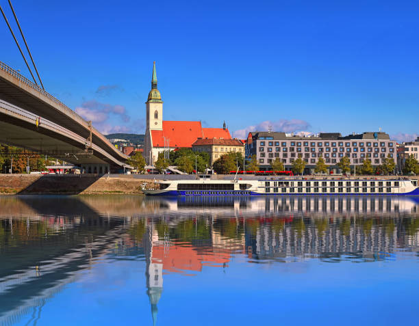 Embankment, St. Martin's Cathedral and reflection in the water, Bratislava, Slovakia. Reflection in water Embankment, St. Martin's Cathedral and reflection in the water, Bratislava, Slovakia. Reflection in water st. martins stock pictures, royalty-free photos & images