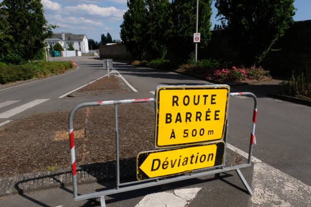 Work sign Traffic sign indicating a blocked road and a detour road closed sign horizontal road nobody stock pictures, royalty-free photos & images