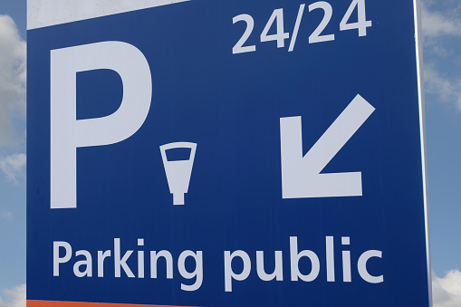 close-up of a sign indicating a public car park open 24 hours a day