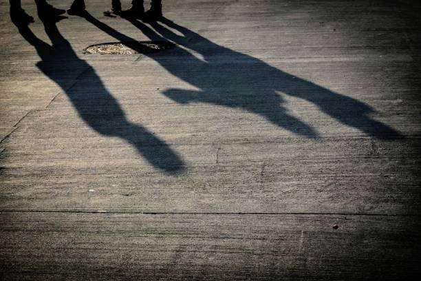 istock Human shadows on the street 1248163175