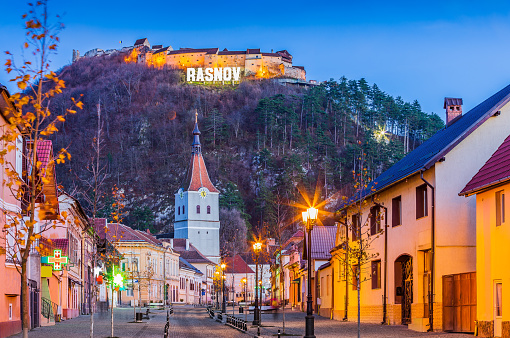 Brasov, Romania November 20, 2016: Downtown Rasnov and hilltop fortress.