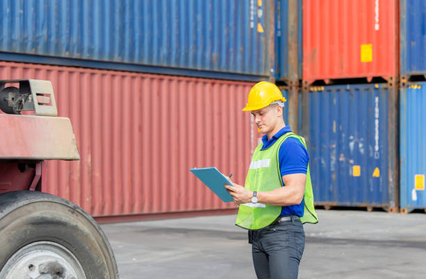 istock Mechanics checking wheel in cargo container. Professional technician pre-check forklift truck tires, safety concept. 1248165957