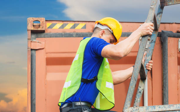 istock Worker go up climbing the ladder to the container 1248165971