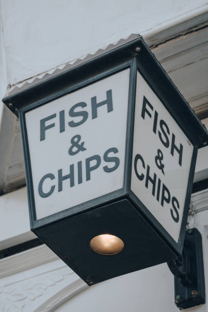 istock Fish and Chip sign outside a restaurant in London, UK. 1248166898