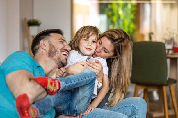 istock Young loving family having fun at home. 1248166968