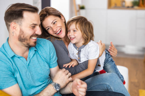 istock Young happy family having fun at home. 1248168016