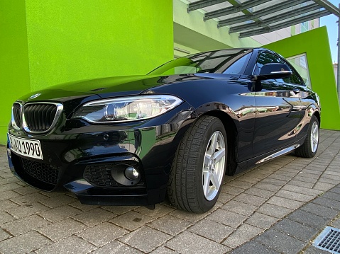 Marbach, Germany - April, 25 - 2020: BMW 220i parked on a public parking space.
