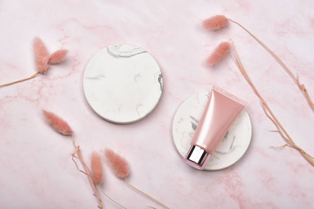 istock Cosmetic bottle containers on pink marble background, Blank label package for branding mock-up, Natural organic beauty product concept, Research and development of purified skincare. 1248170372