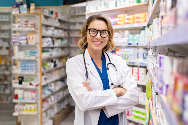 istock Happy smiling pharmacist in drugstore 1248170408