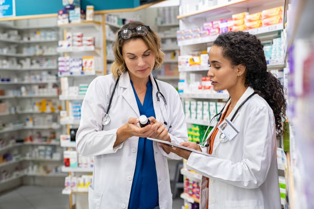 istock Two pharmacists working together at pharmacy 1248170460