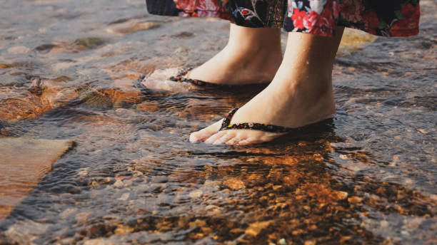 istock Feet soaking in the lake 1248172342