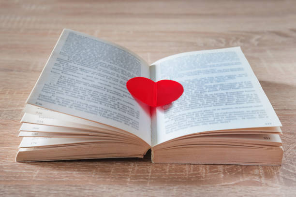 istock Red heart in the open book 1248172459