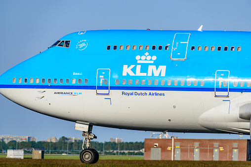 KLM Boeing 747 airplane landing at Schiphol Airport near Amsterdam in The Netherlands.