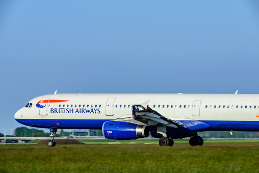 British Airways Airbus A321-231 taking off from Amsterdam Airport Schiphol from the Polderbaan during a day with clear weahter.