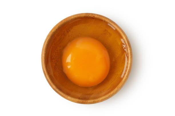 istock Egg in wooden bowl on white background 1248174303