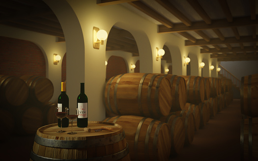Bottles and glasses of red wine in a Wine Cellar