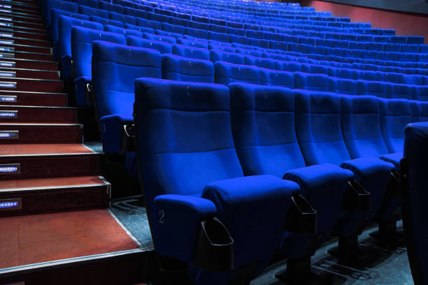 istock Absolutely empty blue chairs in cinema with nobody 1248174515