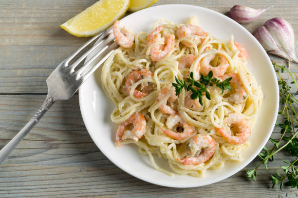 istock spaghetti with prawns in cream sauce. 1248176382