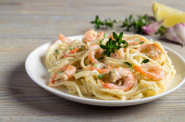 istock spaghetti with prawns in cream sauce. 1248176427