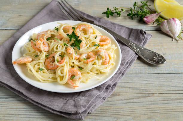 istock spaghetti with prawns in cream sauce. 1248176992
