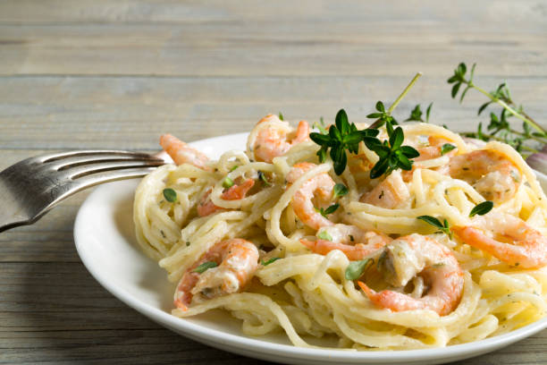 istock spaghetti with prawns in cream sauce. 1248177104