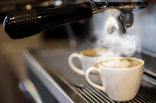 istock Two Cups Of Expresso on Coffee Maker 1248177127