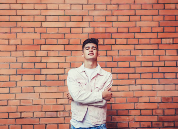 istock Young stylish man posing with a trendy outfit 1248177343
