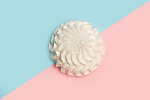 istock Meringue on a pink and light blue background 1248177753