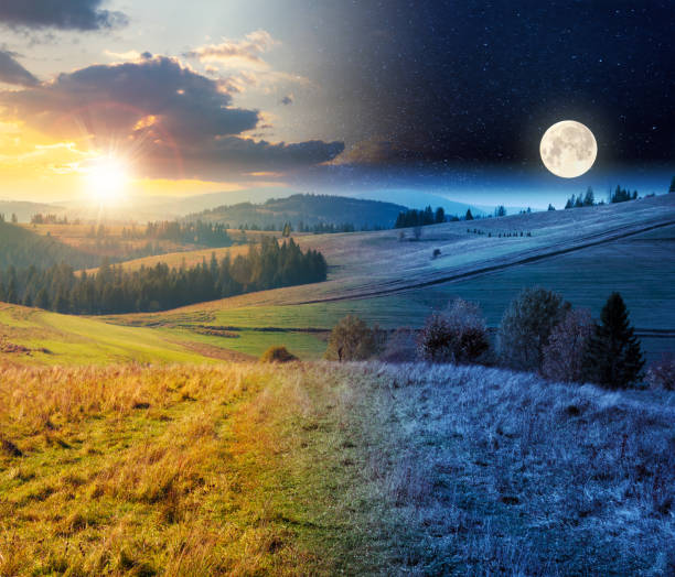 day and night above forest in red foliage day and night time change concept above forest in red foliage. trees with branches with red foliage in forest. hillside in mountains with high peak in the distance with sun and moon dramatic landscape photos stock pictures, royalty-free photos & images