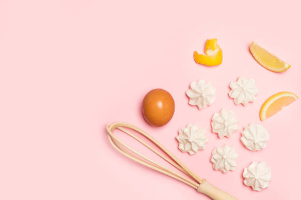 Meringues on a pink background