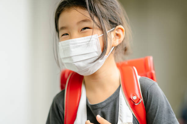 Portrait of happy elementary age school girl A portrait of a happy elementary age school girl. randoseru stock pictures, royalty-free photos & images