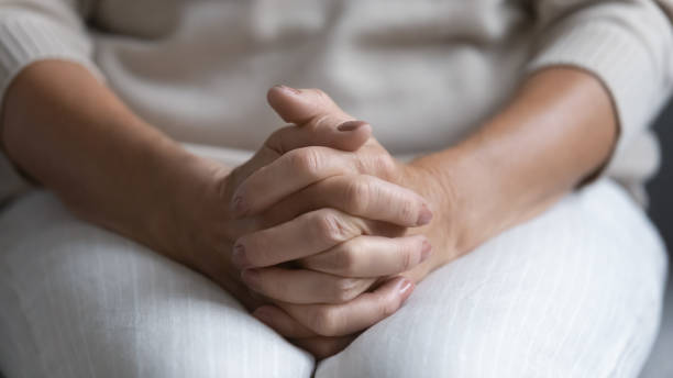 istock Close up of elderly woman sit on couch thinking 1248182162