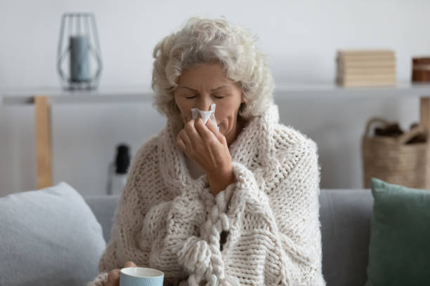 istock Sick senior woman suffer from flu at home 1248182180