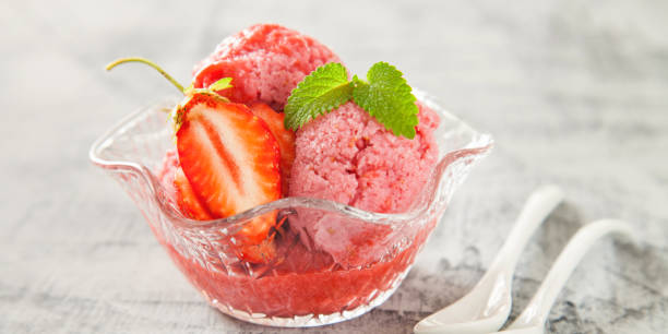 istock ice cream, red sorbet with strawberry on a concrete background, selective focus 1248182312