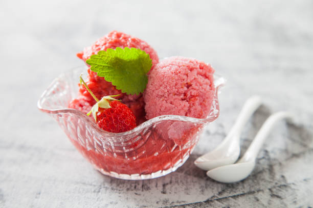 istock ice cream, red sorbet with strawberry on a concrete background, selective focus 1248182314
