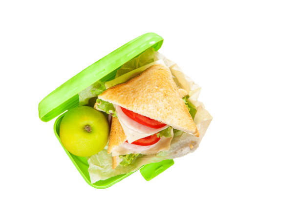 istock school snack - sandwich in the plastic box on a white background, selective focus 1248182343