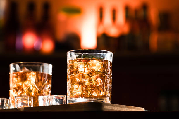 istock Whiskey glasses with ice in a lounge bar 1248187217
