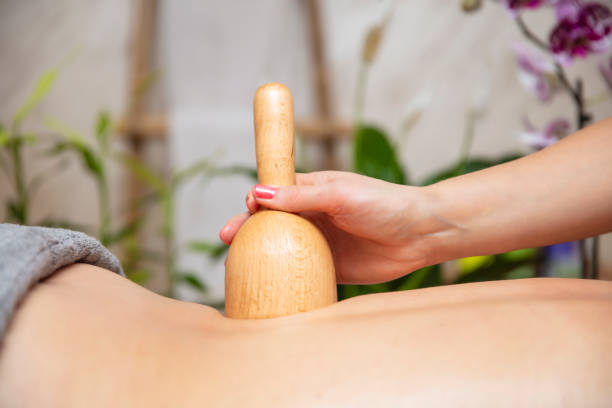 istock Maderotherapy massage with wooden swedish cup 1248187382