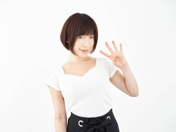 istock Woman posing 4 with fingers on a white background 1248189286