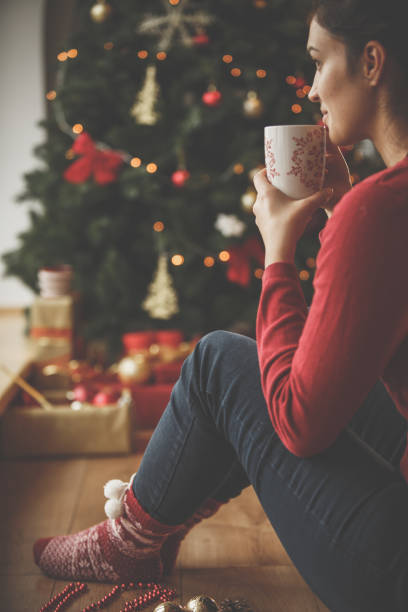 istock Peaceful time by the Christmas tree 1248190594