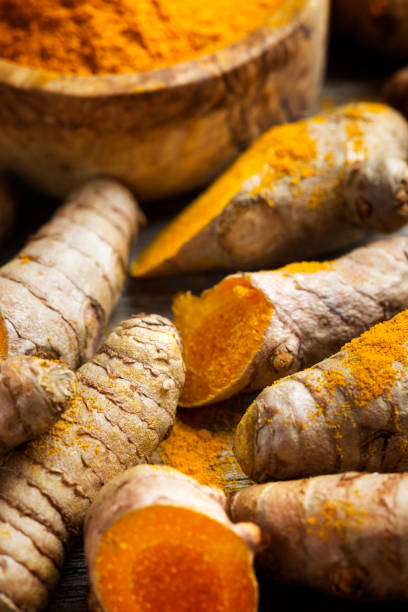 istock Curcuma longa, powder and rhizomes 1248190965
