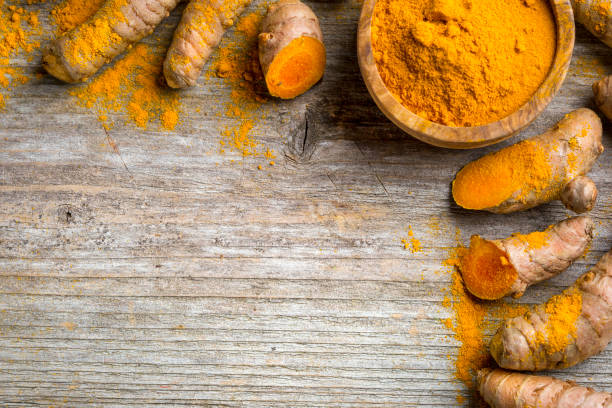 istock Curcuma longa, powder and rhizomes 1248190984