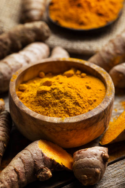 istock Curcuma longa, powder and rhizomes 1248191016