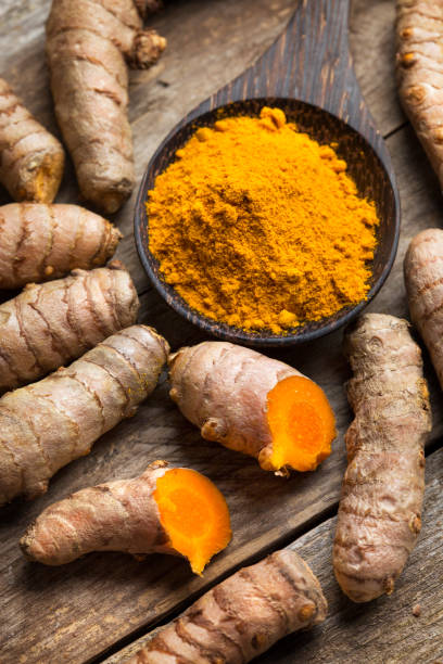 istock Curcuma longa, powder and rhizomes - complementary medicine 1248191059